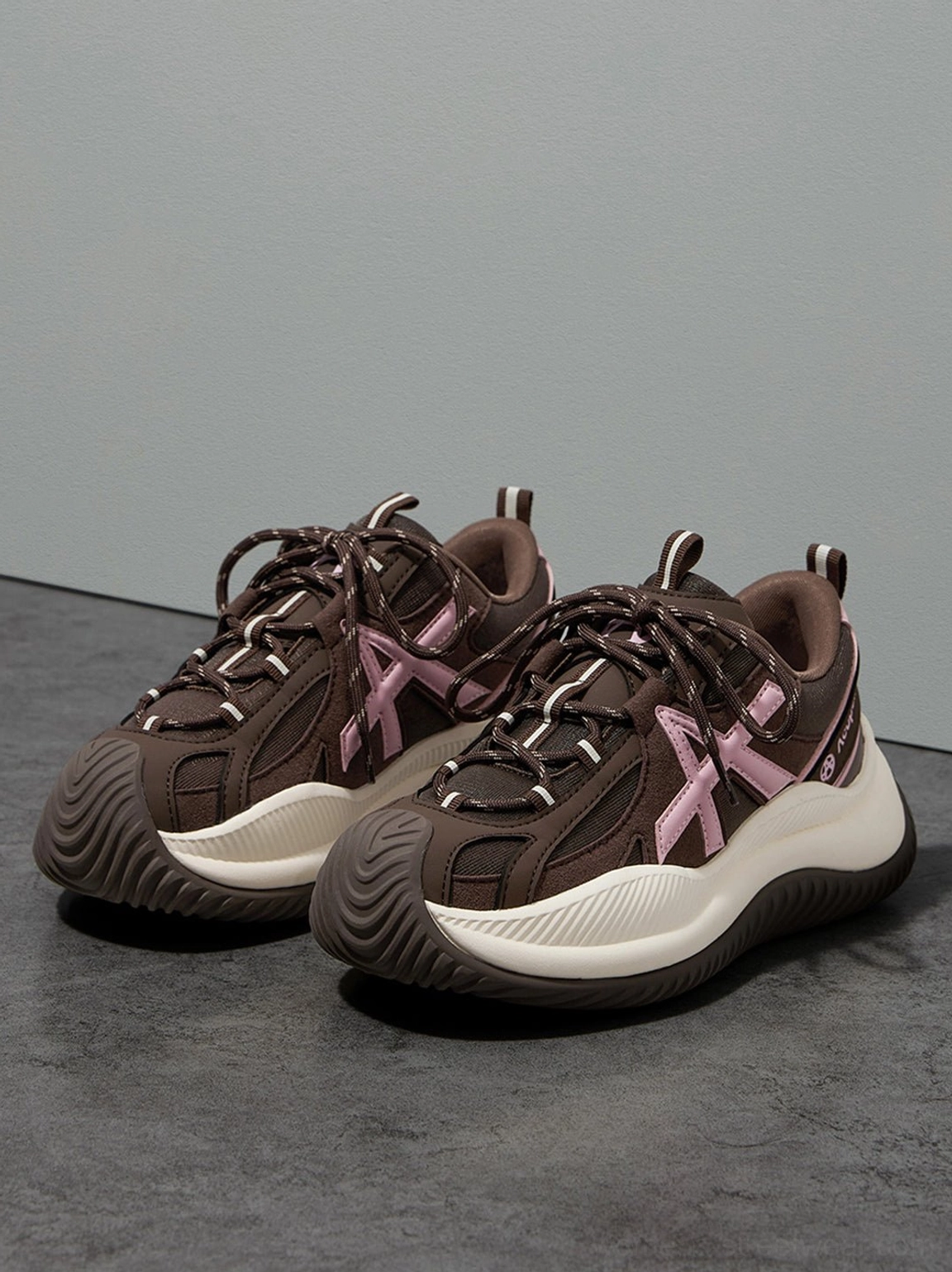 Mixed colorway display of wave-sole chunky sneakers showing gray brown black options available aesthetic variety