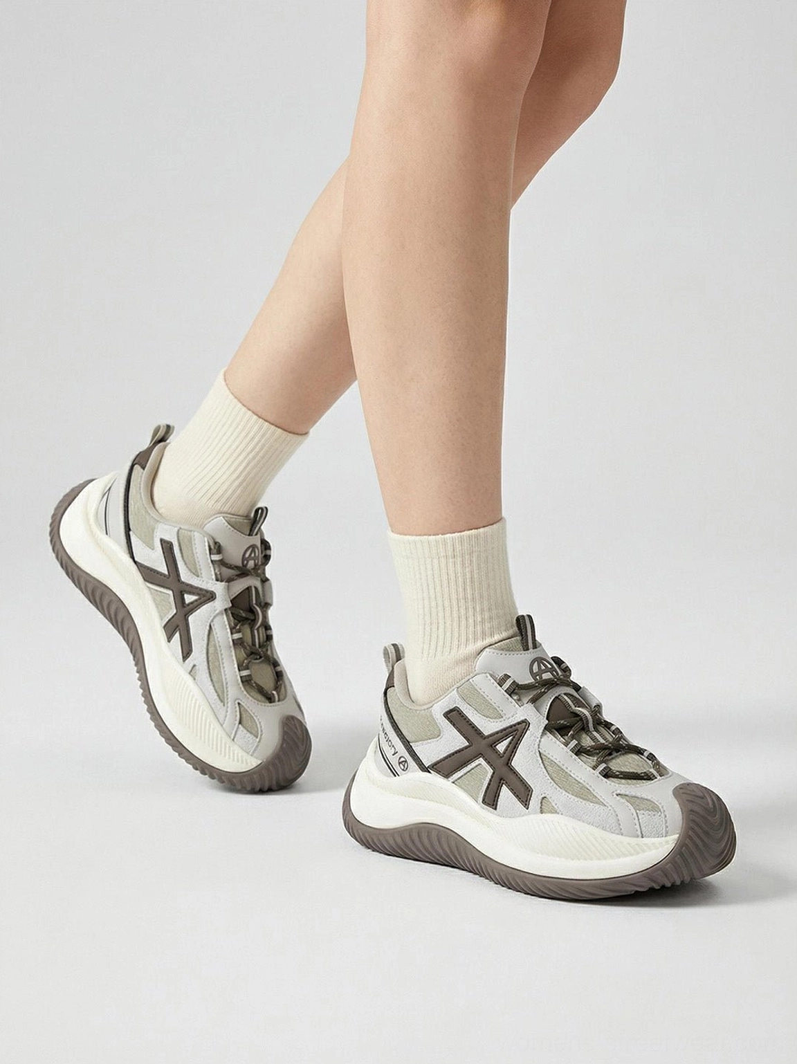 Brown colorway wave-sole chunky sneakers complete presentation earthy aesthetic versatile styling options available