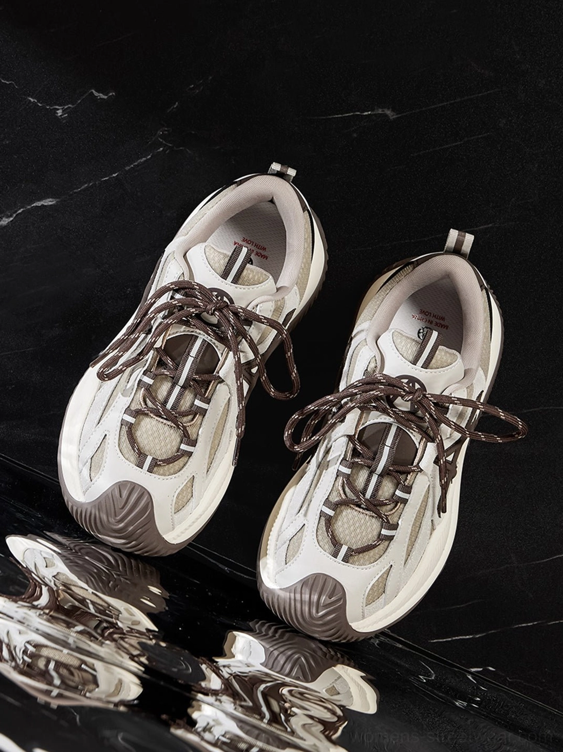 Medial side view of chunky sneakers star lacing perforations visible geometric design balanced aesthetic composition