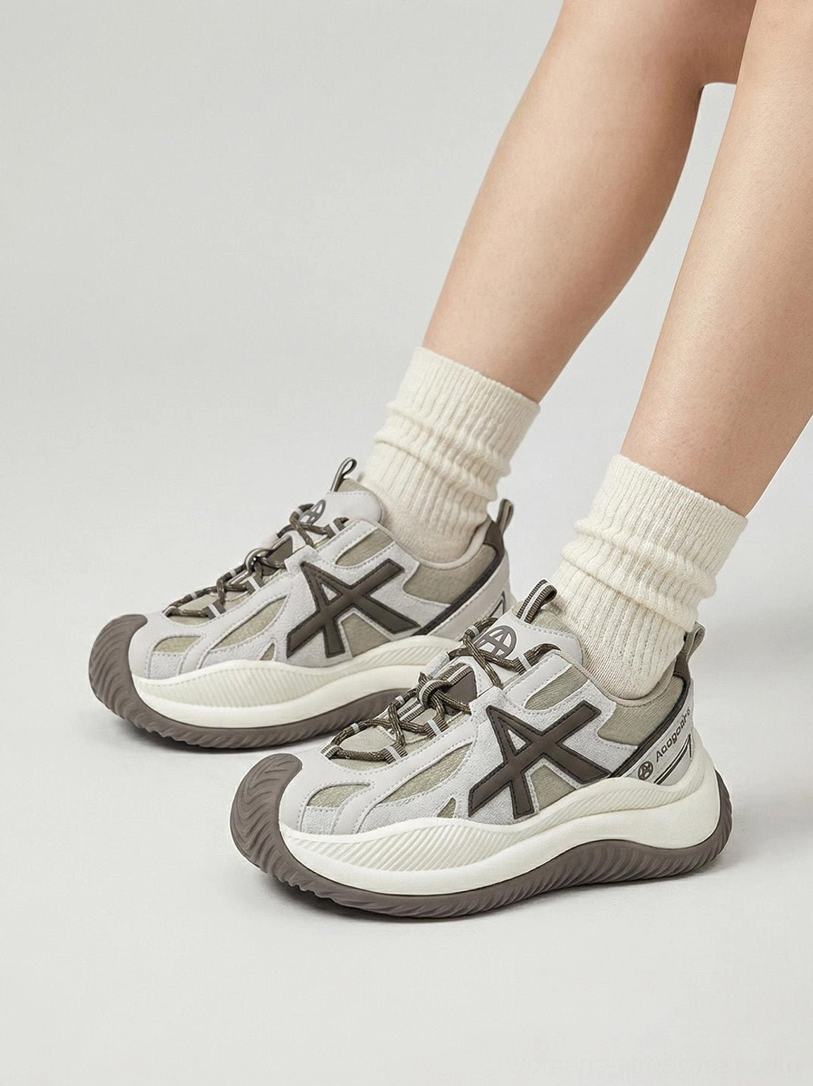 Chunky sneakers angle view showcasing platform elevation height oversized star lacing system design prominence