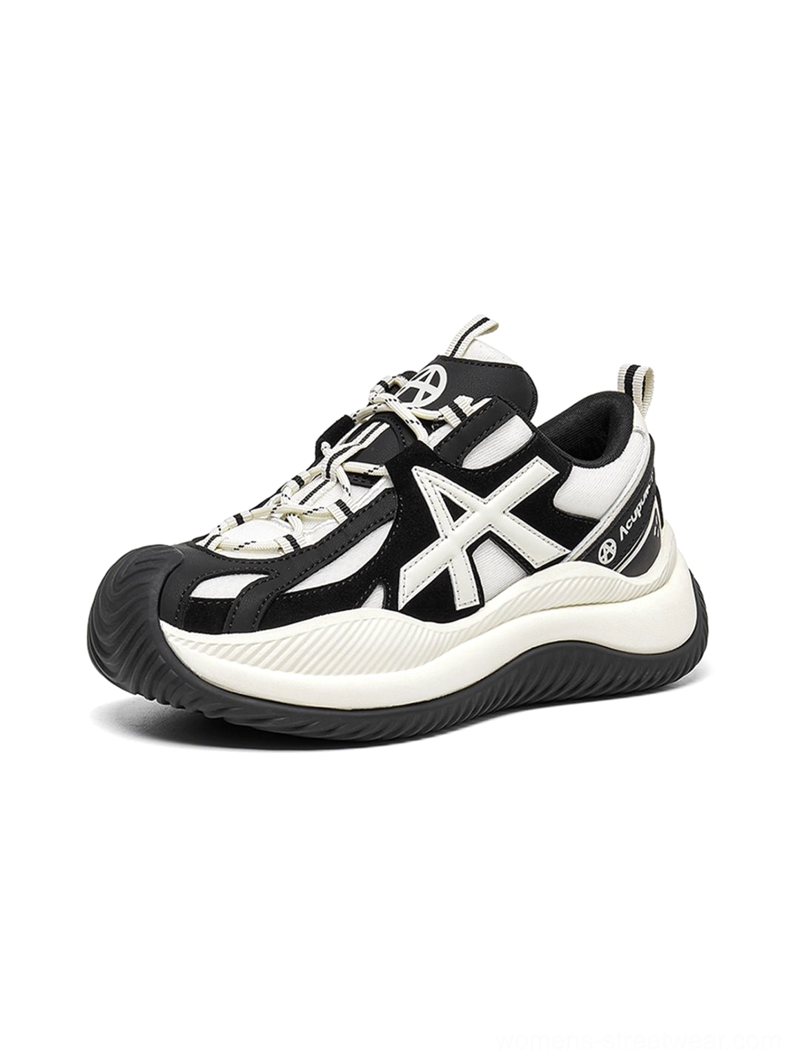 Oversized star lacing detail highlighted on chunky sneakers showing unique perforated closure system geometric design element