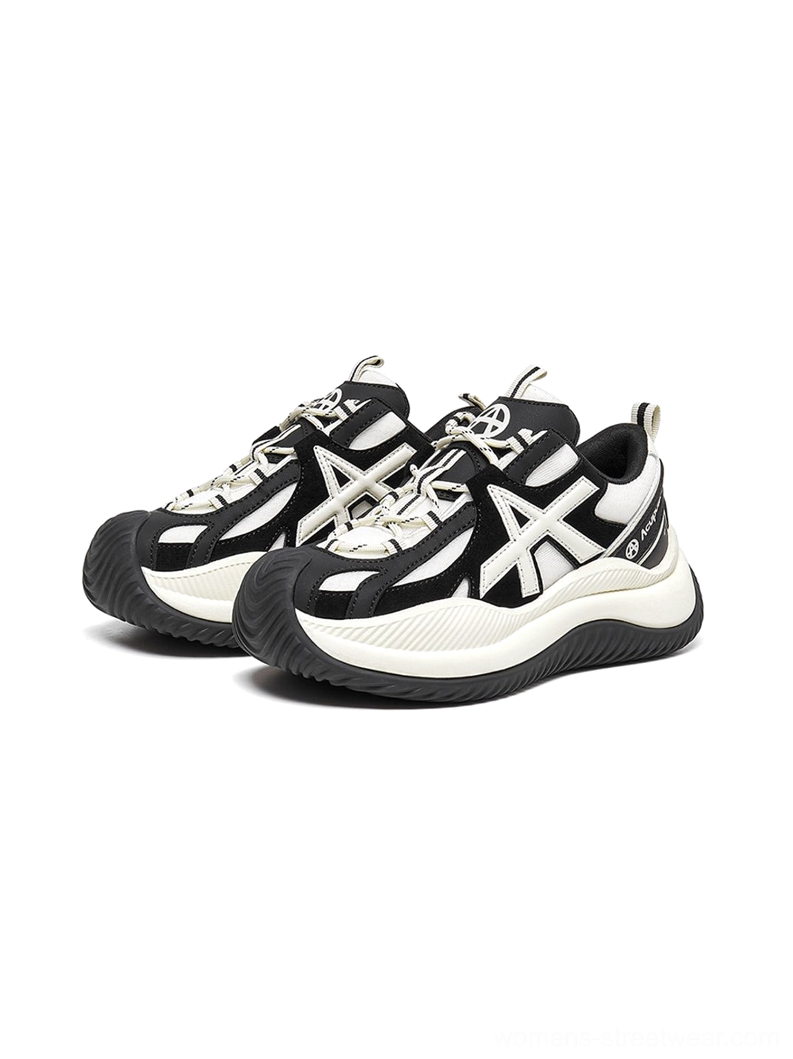 Front three-quarter flat lay of chunky sneakers clear view cross-shaped upper decoration classic black white color blocking sturdy platform