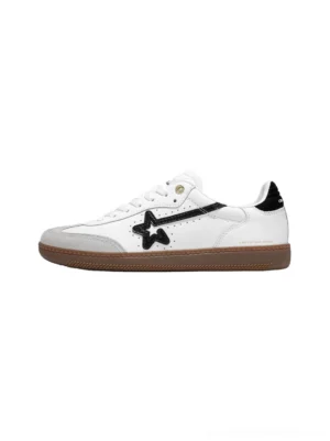 White star-panel low-profile retro trainers with black star and stripe details, gray suede toe cap, black heel tab, and gum rubber outsole