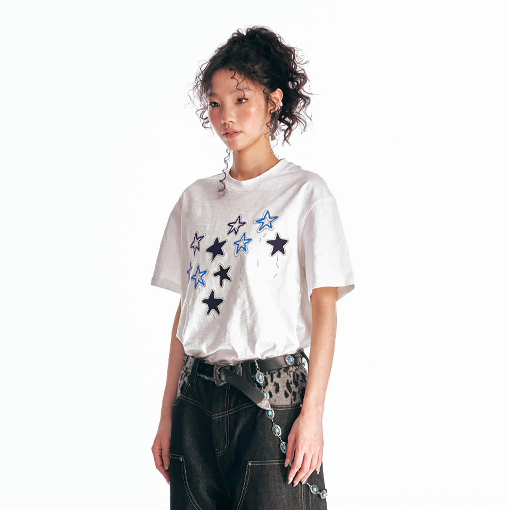 White oversized graphic cotton tee with blue and dark embroidered star parade chest design front upper body view