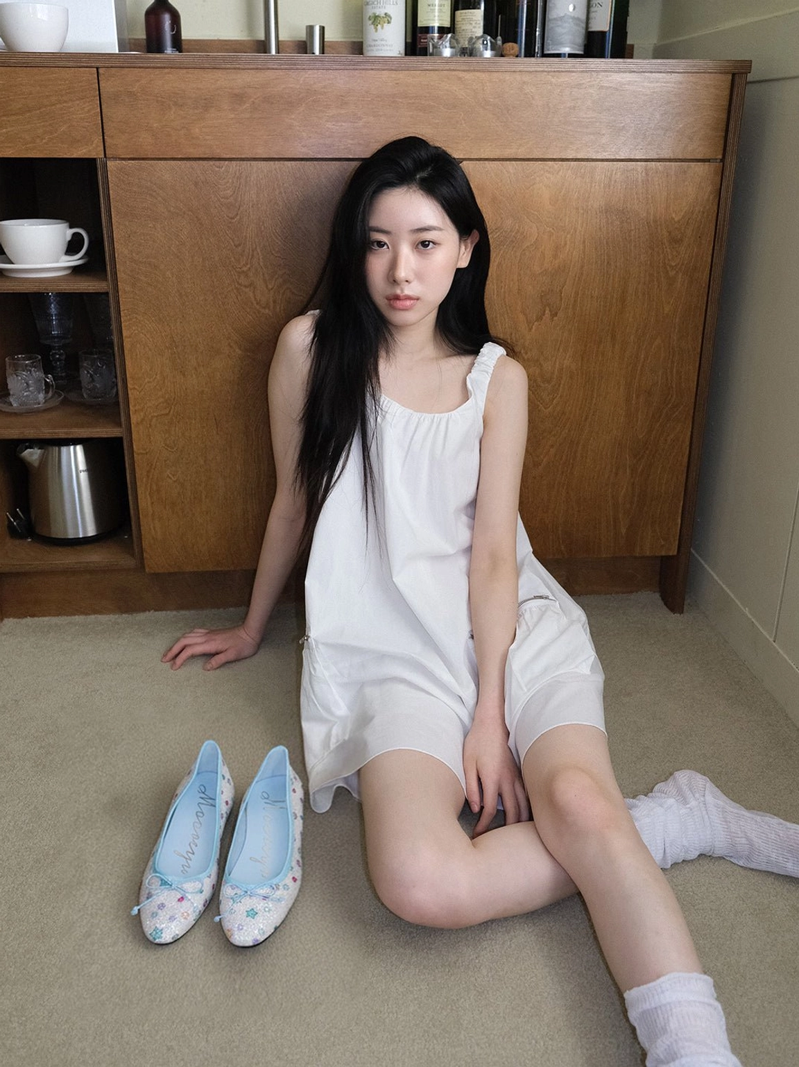 Star print bow ballet flats paired with a white sleep-inspired outfit and casual crew socks