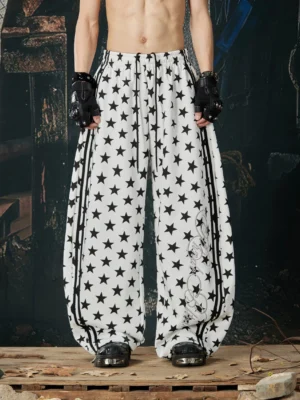 White star print puddle wide-leg streetwear track pants front full-body view with black side stripes