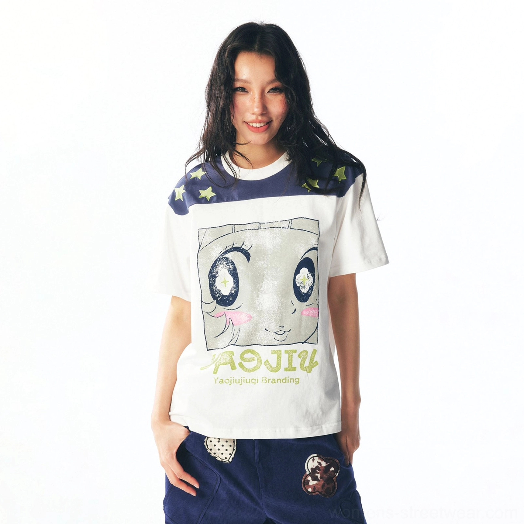 Female model wearing white star shoulder cartoon graphic unisex streetwear tee with navy yellow star shoulder panel