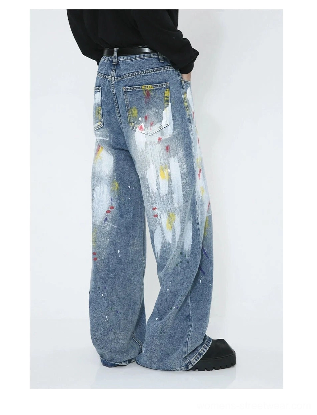 Statement paint splash denim jeans with wide legs, washed blue finish and colorful avant-garde streetwear artwork