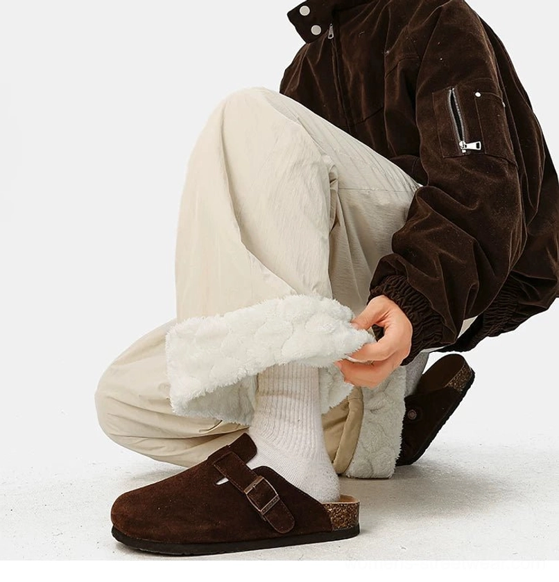 Streetwear fleece pants with adjustable waist, textured shell, comfortable wide-leg cut, and convertible cuffs