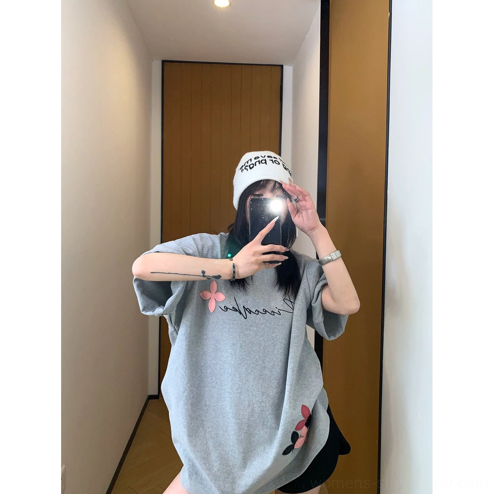 Streetwear floral script T-shirt designed with soft graphic contrast, oversized proportions, cotton fabric, and versatile casual styling