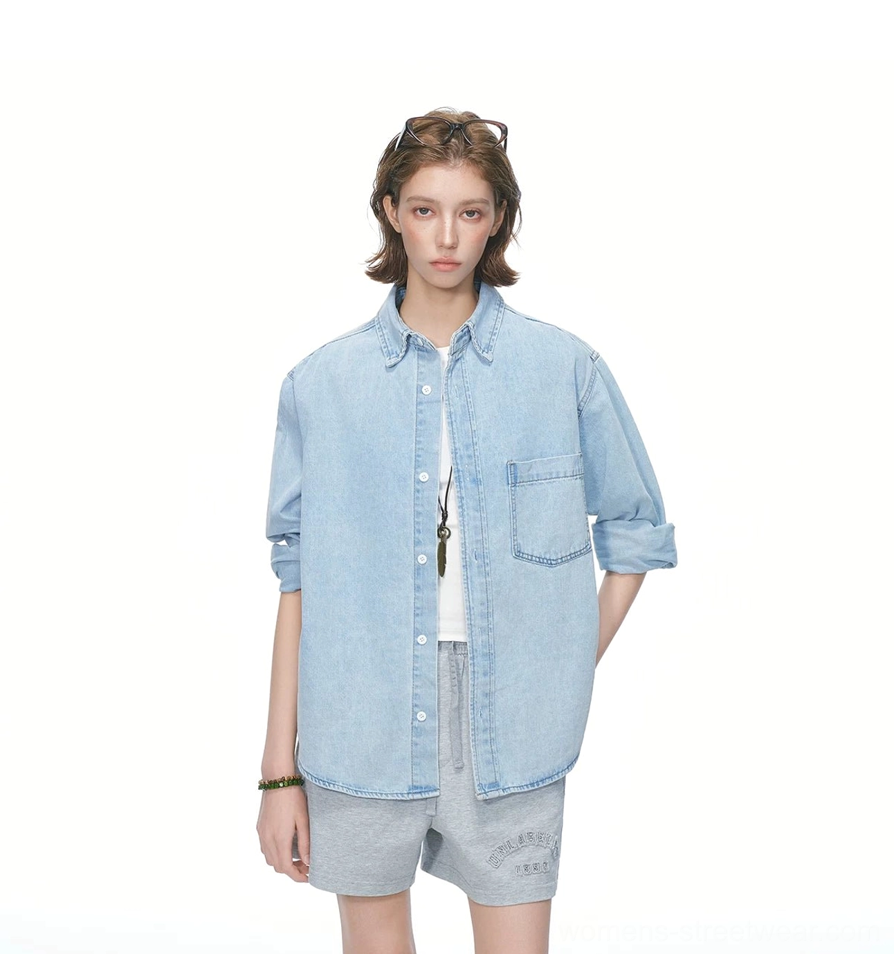 Streetwear oversized denim overshirt featuring a loose boxy fit, button front, curved hem, and functional chest pocket