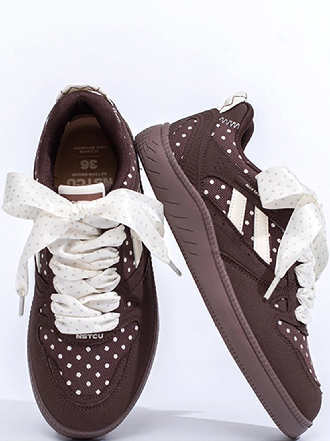 Streetwear polka dot ribbon sneakers designed with contrast details and a chunky skate-inspired outsole