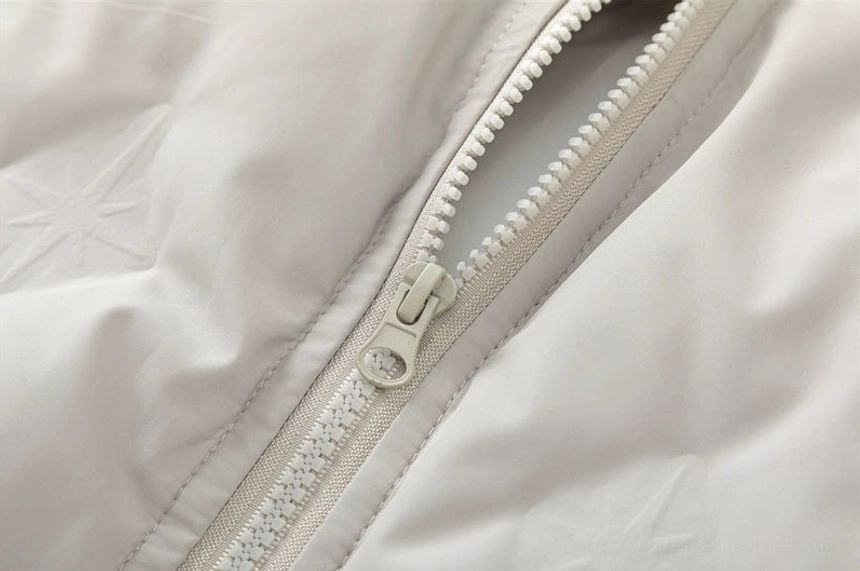 Streetwear quilted bomber jacket with oversized proportions, subtle chest embroidery, and practical layered styling