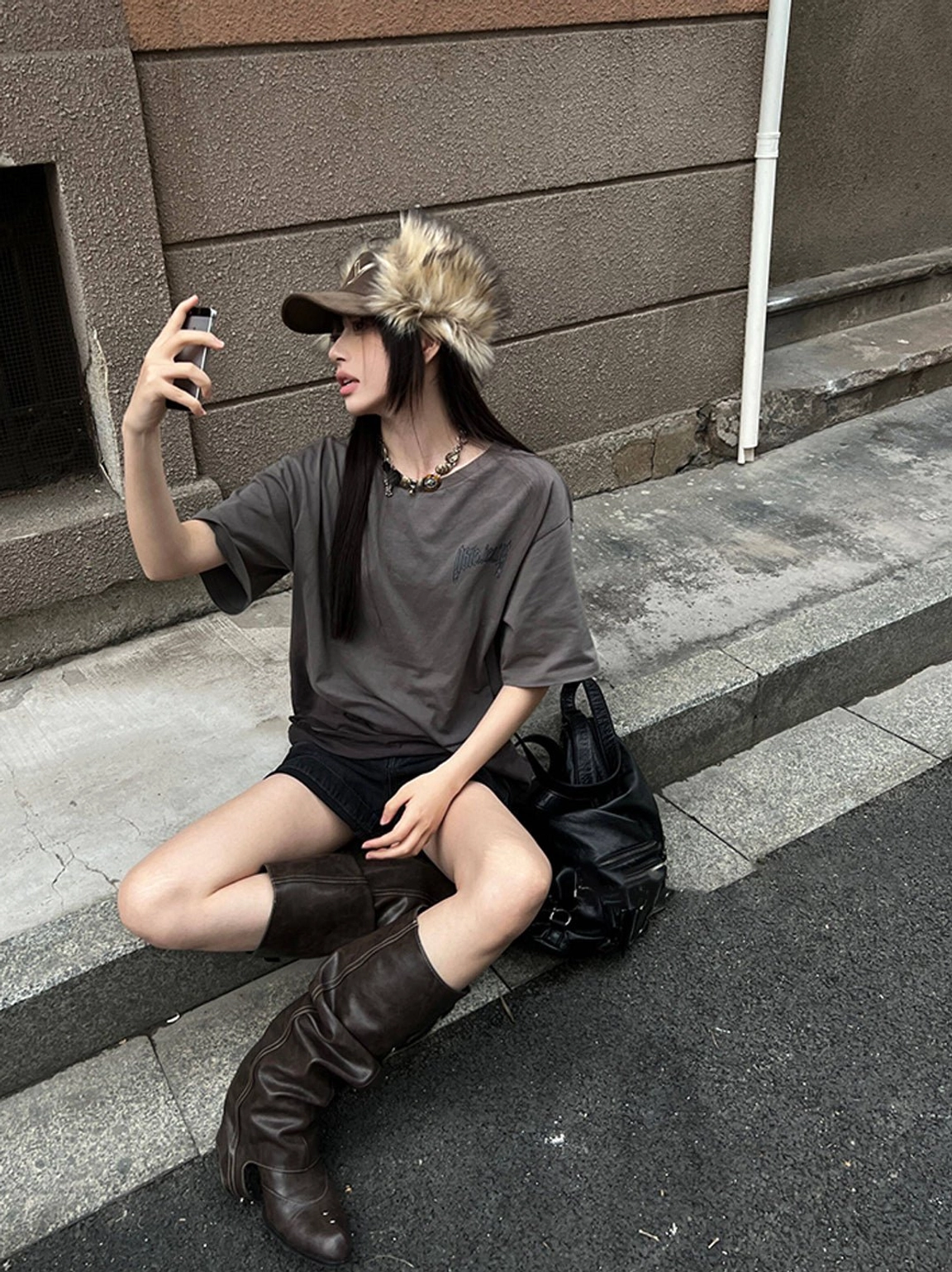 Streetwear western knee-high boots with slouchy ruched shaft, triple buckles, pointed toe, and stacked heel