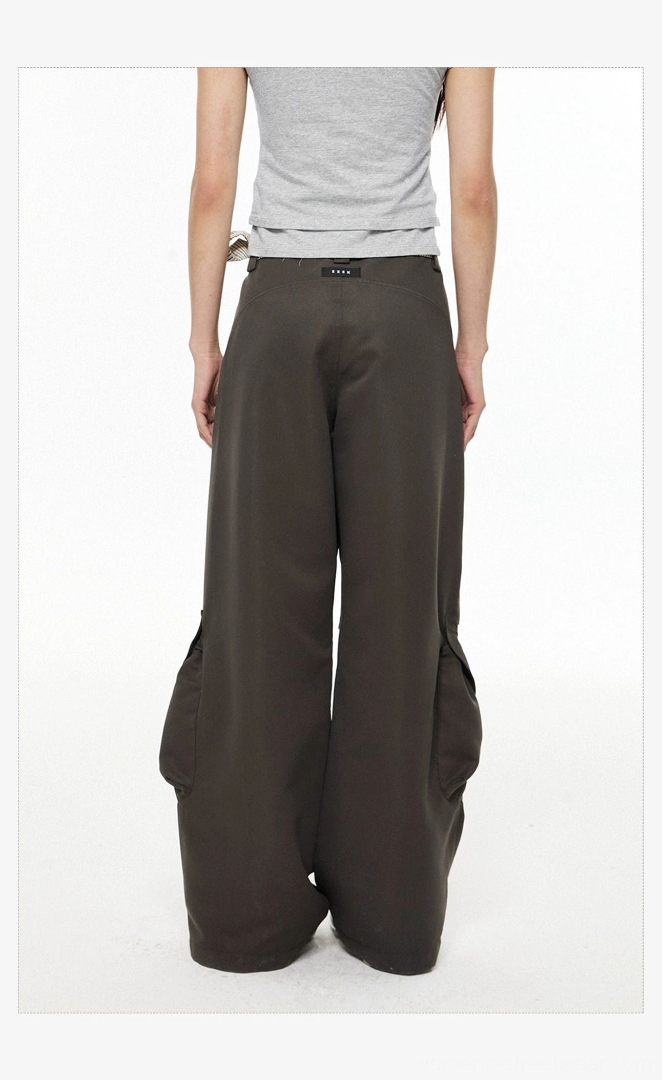 Back view of dark gray wide-leg cargo pants with relaxed drape and oversized side cargo pocket silhouette