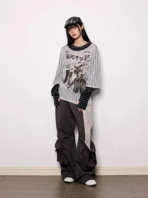 Dark gray wide-leg streetwear cargo pants with striped sash belt styled in a full-body front studio outfit