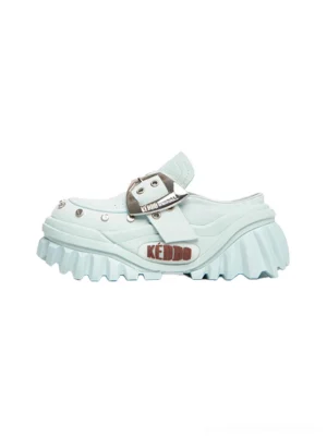 Light blue studded buckle platform Mary Jane mule shoes with oversized silver buckle, metal rivets, chunky ridged sole, and elevated streetwear silhouette