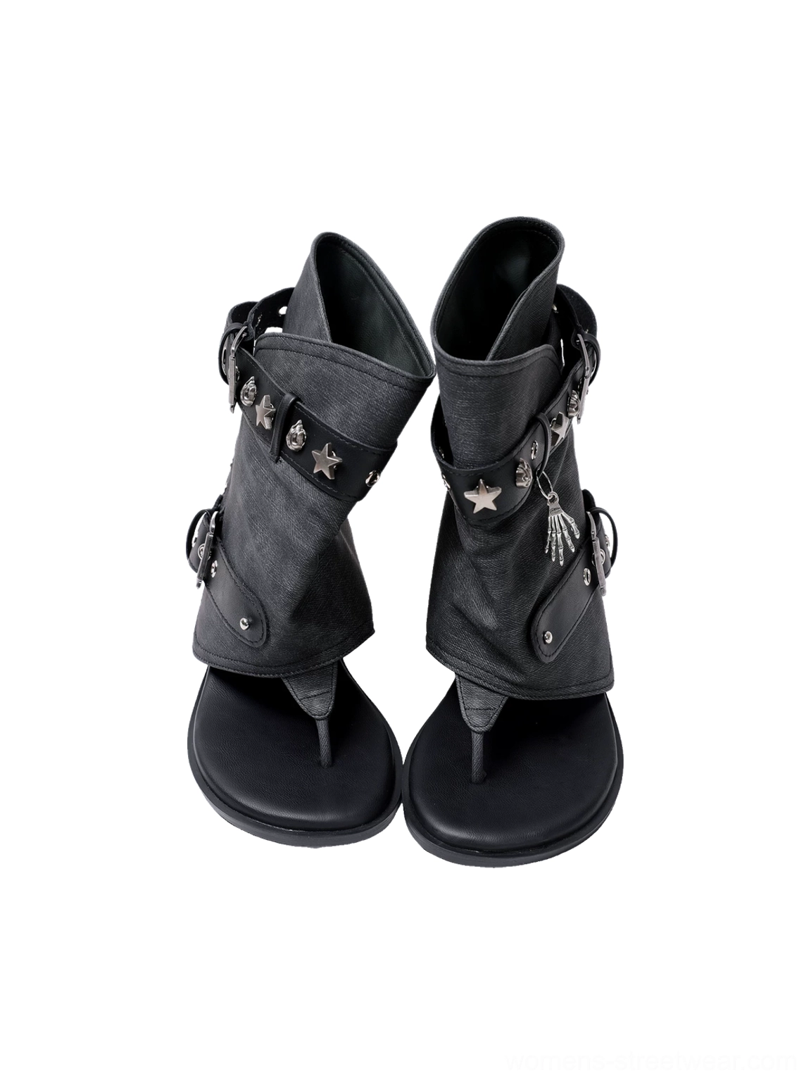 Low front angle of pair of studded buckle thong ankle boot sandals with star charms and open thong toes