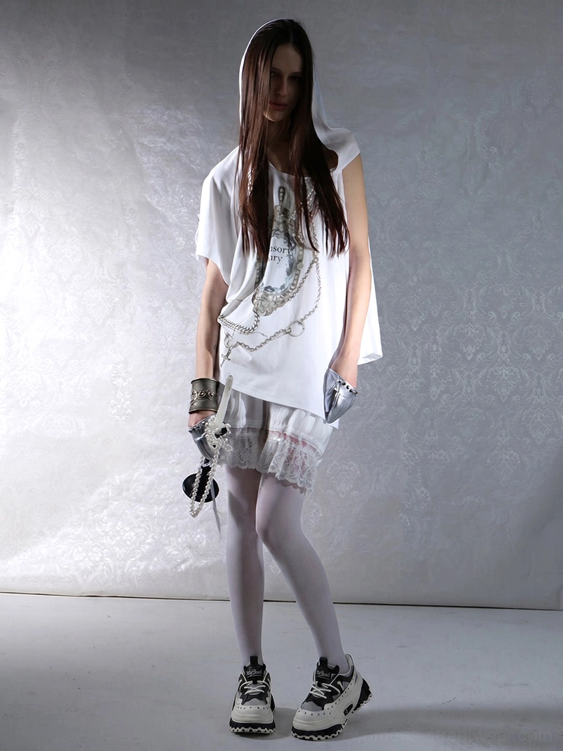 Women’s chunky studded wave-sole platform loafers styled with an oversized graphic tee and Y2K mini skirt outfit