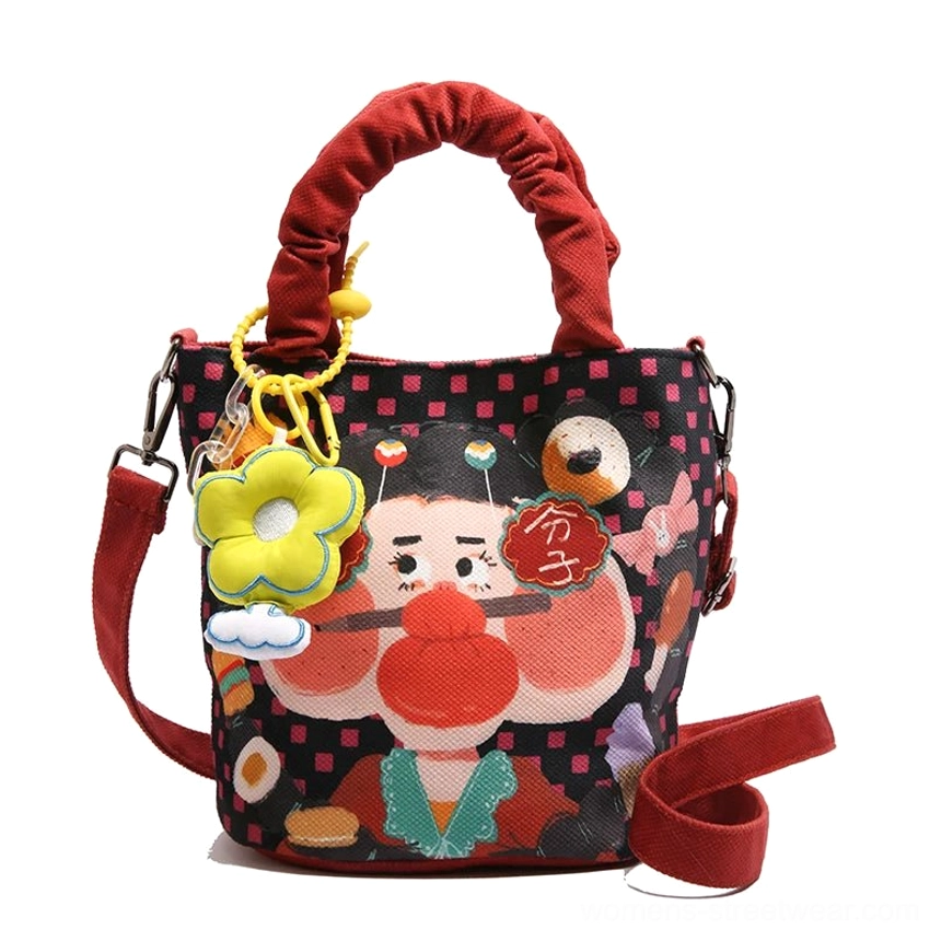 Style 7 black cartoon tote front view showing contrast between dark bag body and illustrated character graphic design element