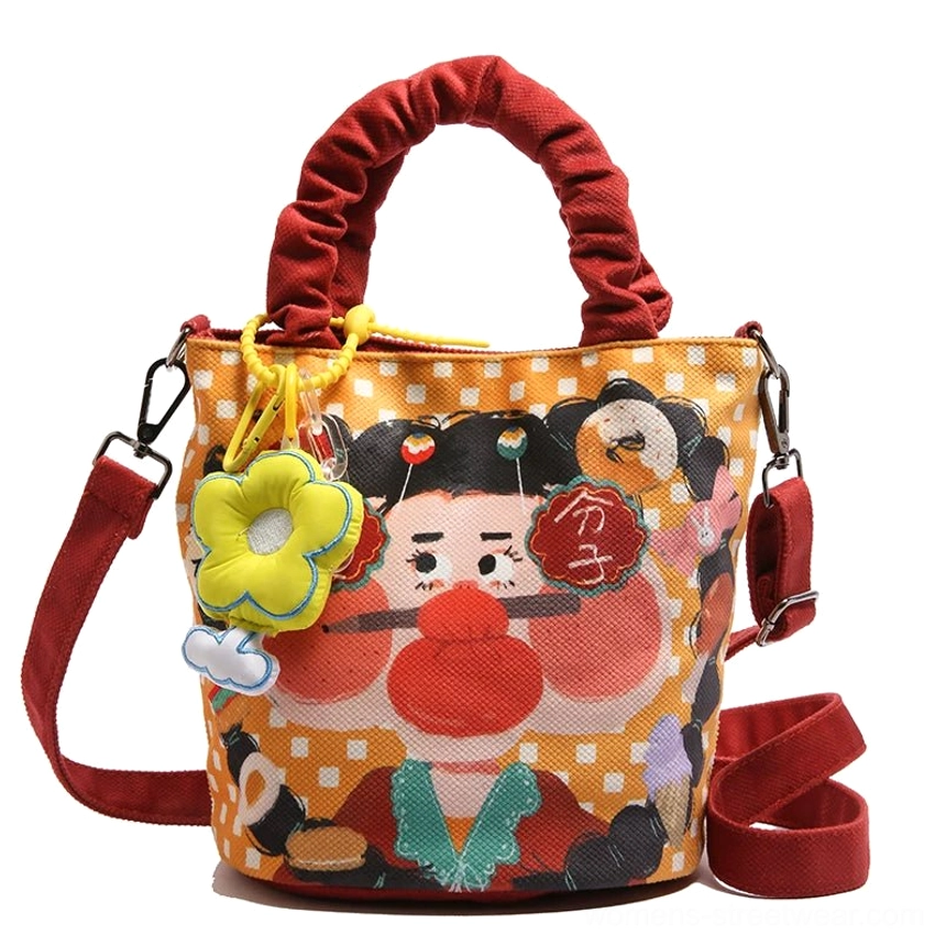 Style 7 orange variant cartoon tote front angle showing Freedom embroidery text and curly-hair girl character design detail