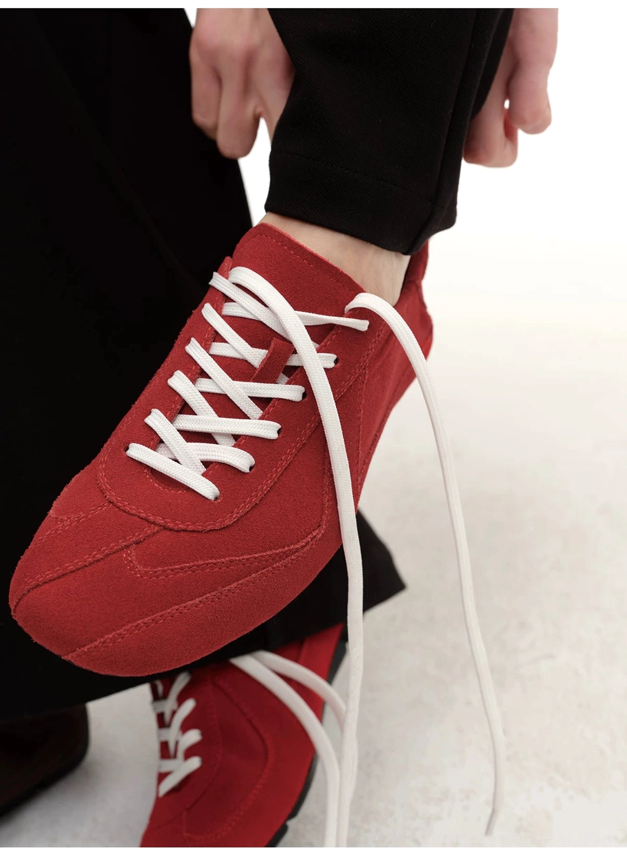 Suede German trainer style minimalist lace-up sneakers product image showing a clean low-top streetwear silhouette