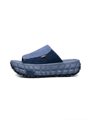 Blue suede tire-tread platform mule slides with chunky rugged outsole shown in left side profile on white background