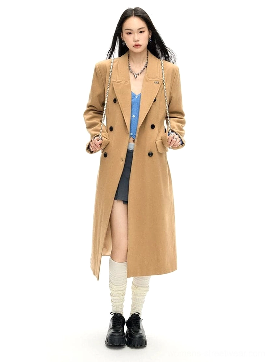 Tailored double-breasted wool long coat showing its structured longline outerwear silhouette