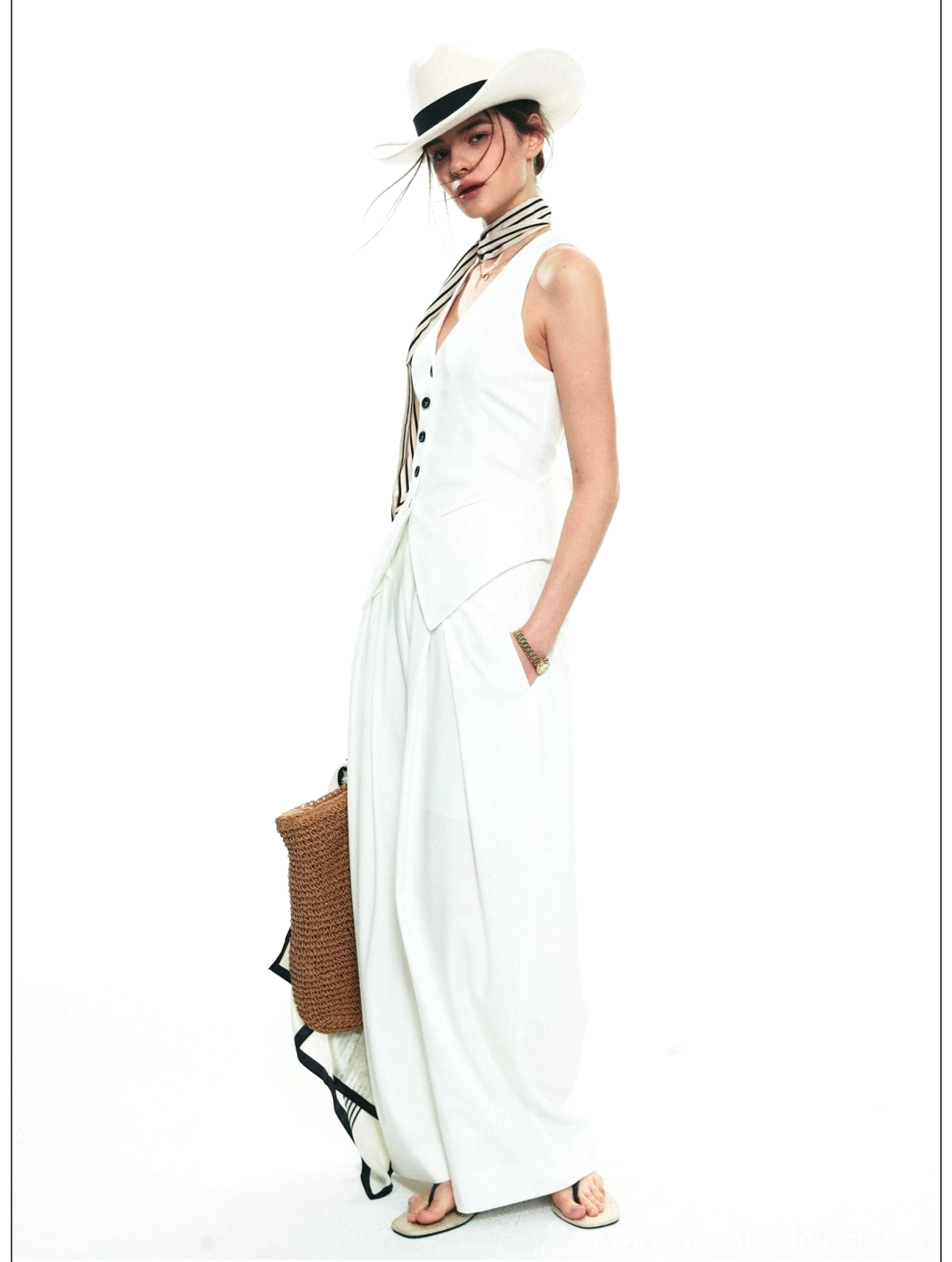 Tailored halter vest and wide-leg trousers streetwear set styled in a polished contemporary fashion outfit