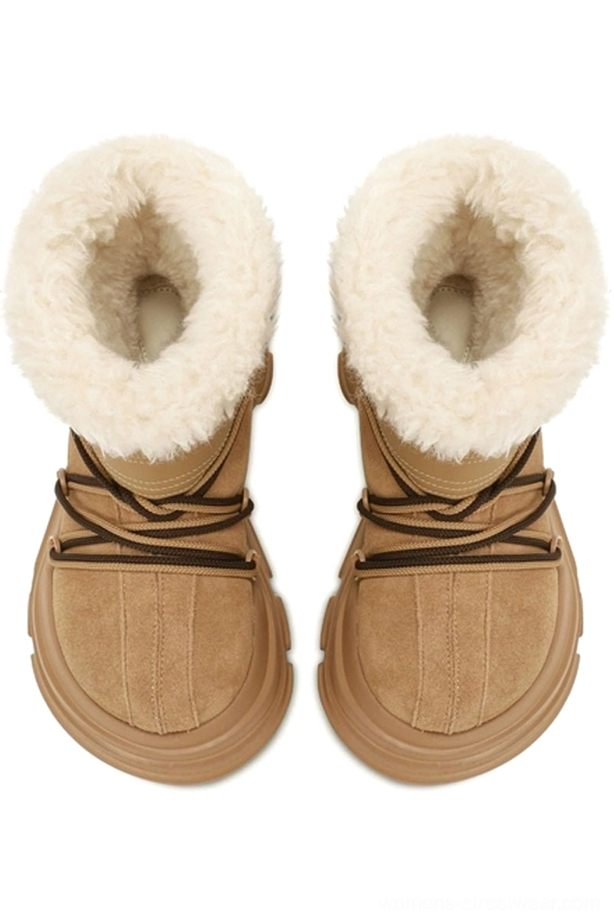 Front view of pair of tan suede-look winter snow boots with white faux fur collars and black drawstring laces
