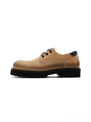 Tan full-grain leather lug sole derby shoes in side view with black waxed laces and chunky black rubber outsole