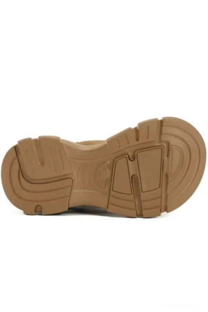Treaded camel brown EVA outsole on tan platform winter snow boots shown from below