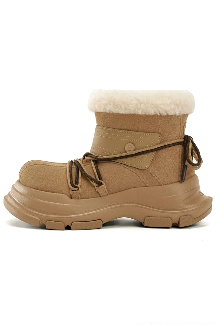 Tan suede-look platform winter snow boot with white faux fur trim and black drawstring laces in left side profile