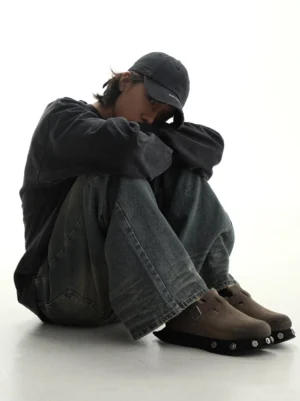 Taupe suede studded platform buckle clogs styled with hoodie, vintage denim, and casual streetwear outfit