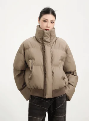 Teddy Brown cropped puffer winter jacket with high stand collar ribbed hem dropped shoulders and side pockets styled for Korean streetwear
