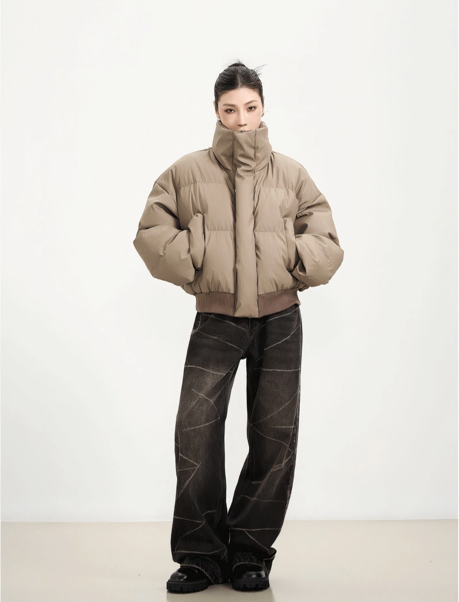 Teddy Brown short cropped puffer jacket with ribbed cuffs and hem styled with wide-leg jeans and loafers