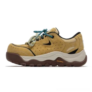 Yellow brown Terrain Crest chunky trail sneakers in side profile with suede-like panels, mesh inserts, teal laces, and rugged lug sole