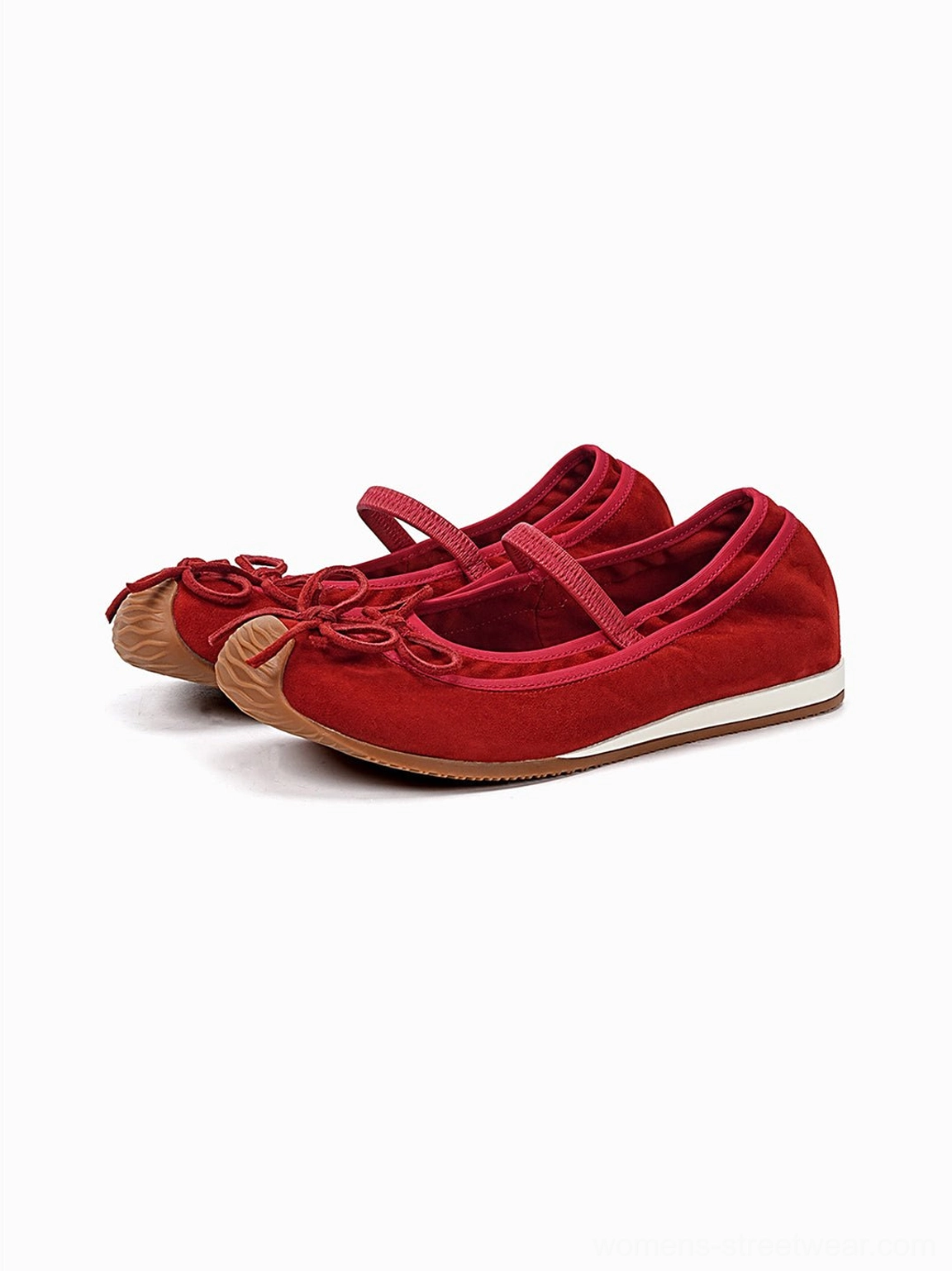 Pair of deep red textured bow Mary Jane ballet flats with round toe straps and brown rubber soles