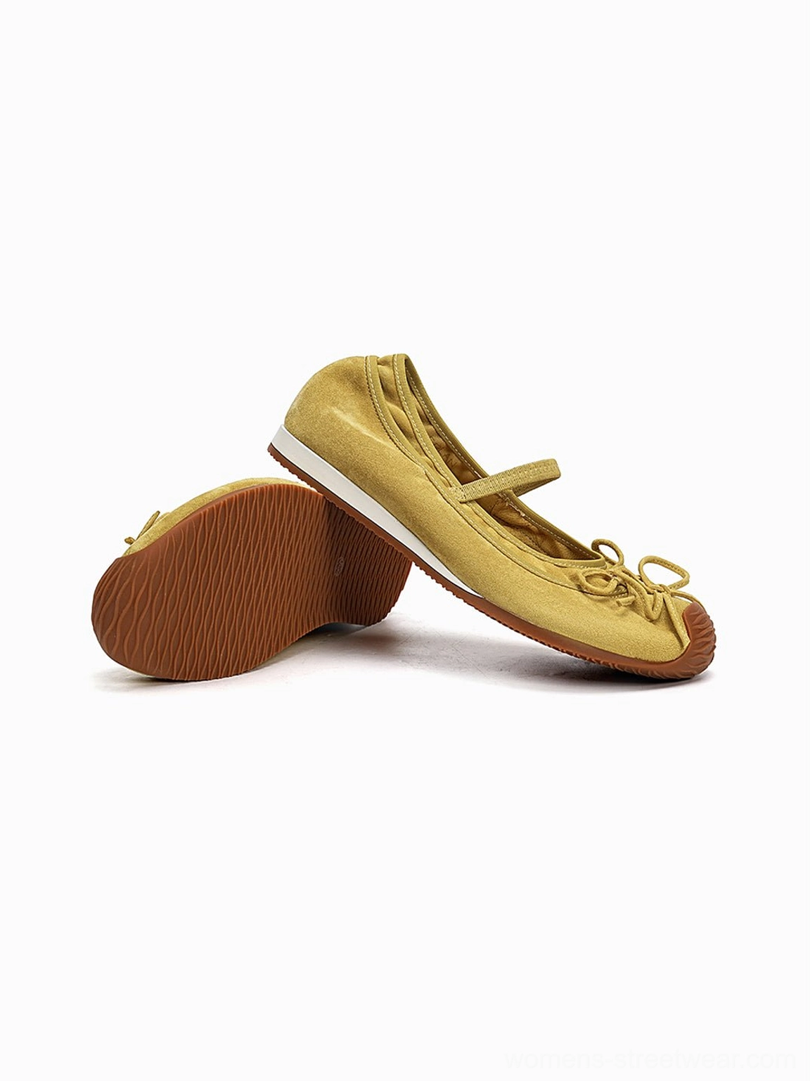 Mustard yellow bow Mary Jane ballet flats showing textured upper low profile and contrast rubber outsole