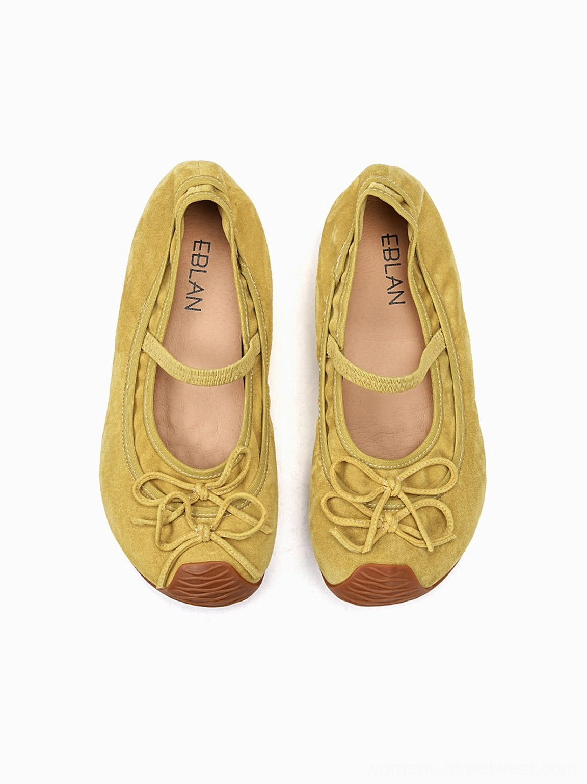 Top view of mustard yellow textured bow Mary Jane ballet flats with slim instep straps and rounded toes