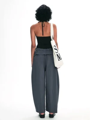 Back view of black halter backless cropped tank top with adjustable self-tie neck straps