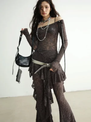 Front view of textured ruffle lace dance pant set with off shoulder top and asymmetric hem in a minimalist studio