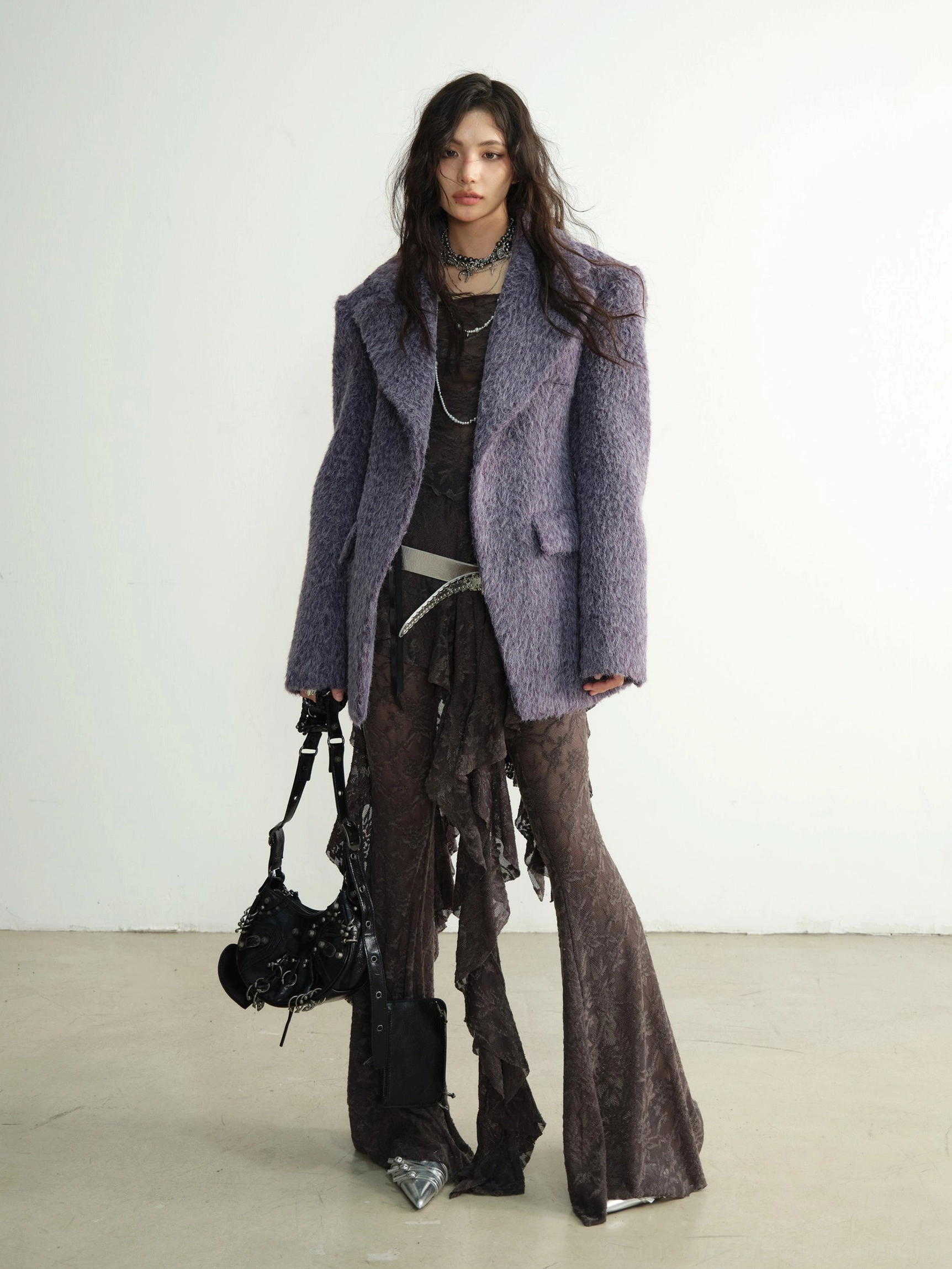 Layered streetwear styling with textured lace dance pant set and oversized fuzzy purple blazer