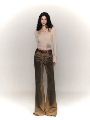 Female model wearing a light khaki tie-dye wide collar long sleeve streetwear base layer with vintage flared denim pants