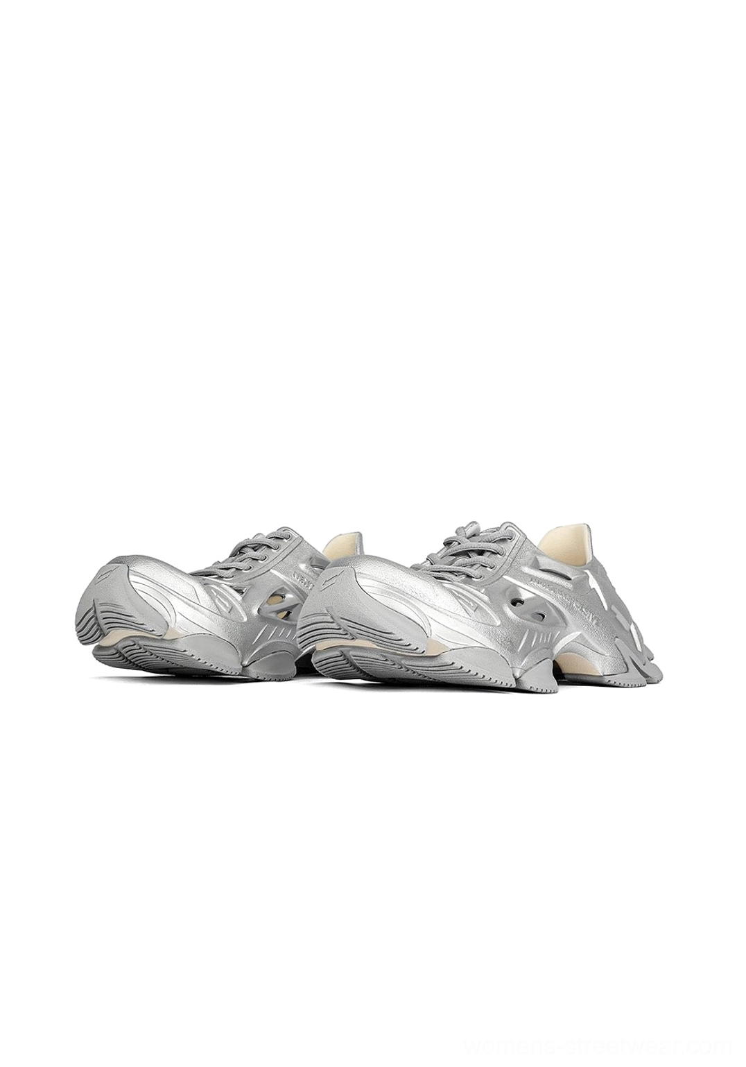 Pair of silver Time-Space platform clog sneakers displayed from above with sculptural cutouts and elevated rubber soles