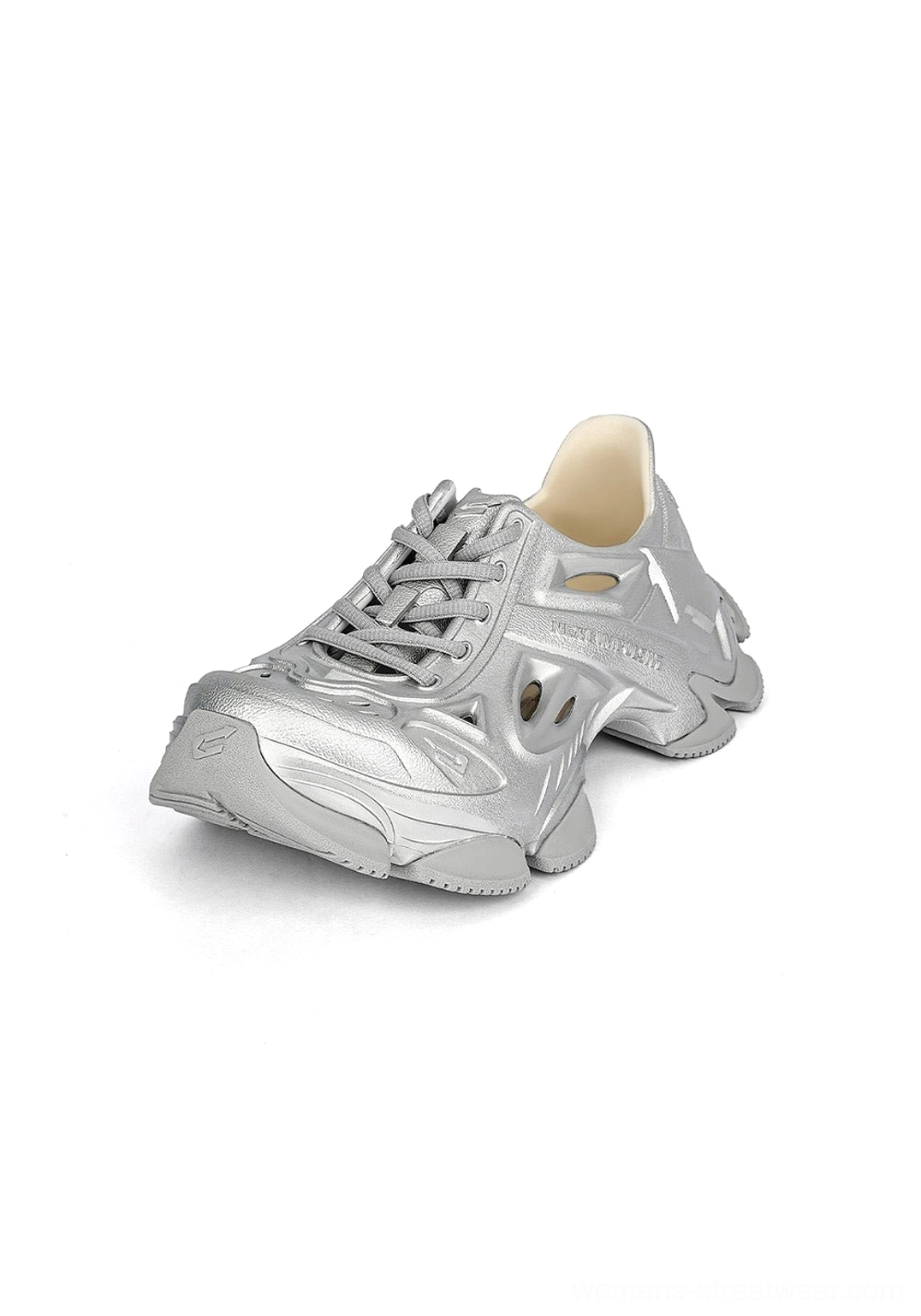 Right side view of a silver Time-Space platform clog sneaker showing the vented molded upper and oversized sole