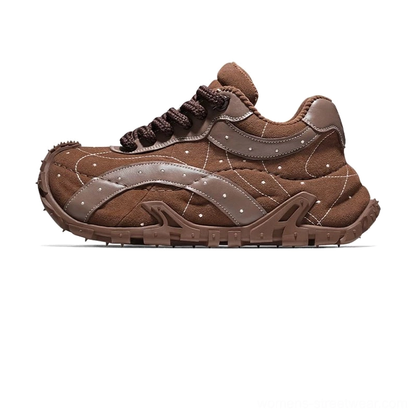 Brown TrailGrid chunky sneakers shown from the rear with tonal laces, stitched leather upper, matching chunky rubber outsole, and rugged traction pattern
