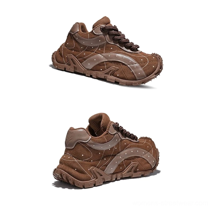 TrailGrid chunky streetwear sneakers in brown with stitched leather panels, decorative dot accents, textured matching outsole, and outdoor-inspired right side profile