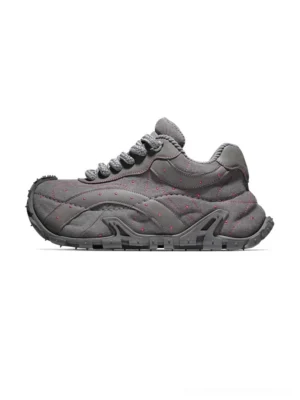 TrailGrid chunky streetwear sneakers in dark gray with layered leather upper, quilted side stitching, decorative dot details, and rugged anti-slip outsole shown in left side profile