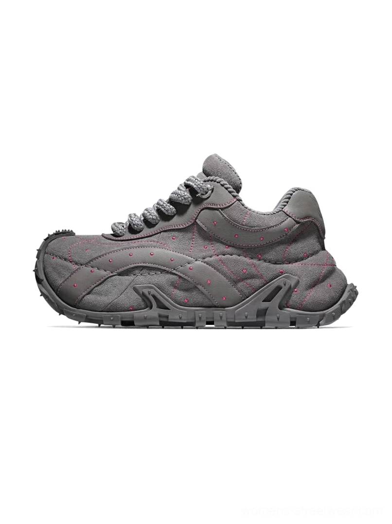 TrailGrid chunky streetwear sneakers in dark gray with layered leather upper, quilted side stitching, decorative dot details, and rugged anti-slip outsole shown in left side profile